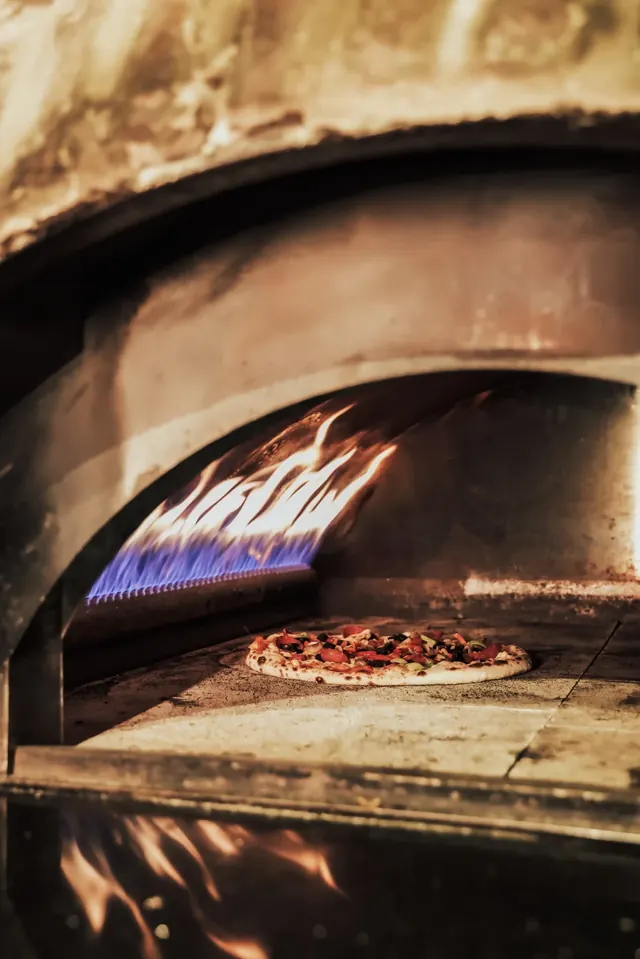 Pizza baking in the stone oven